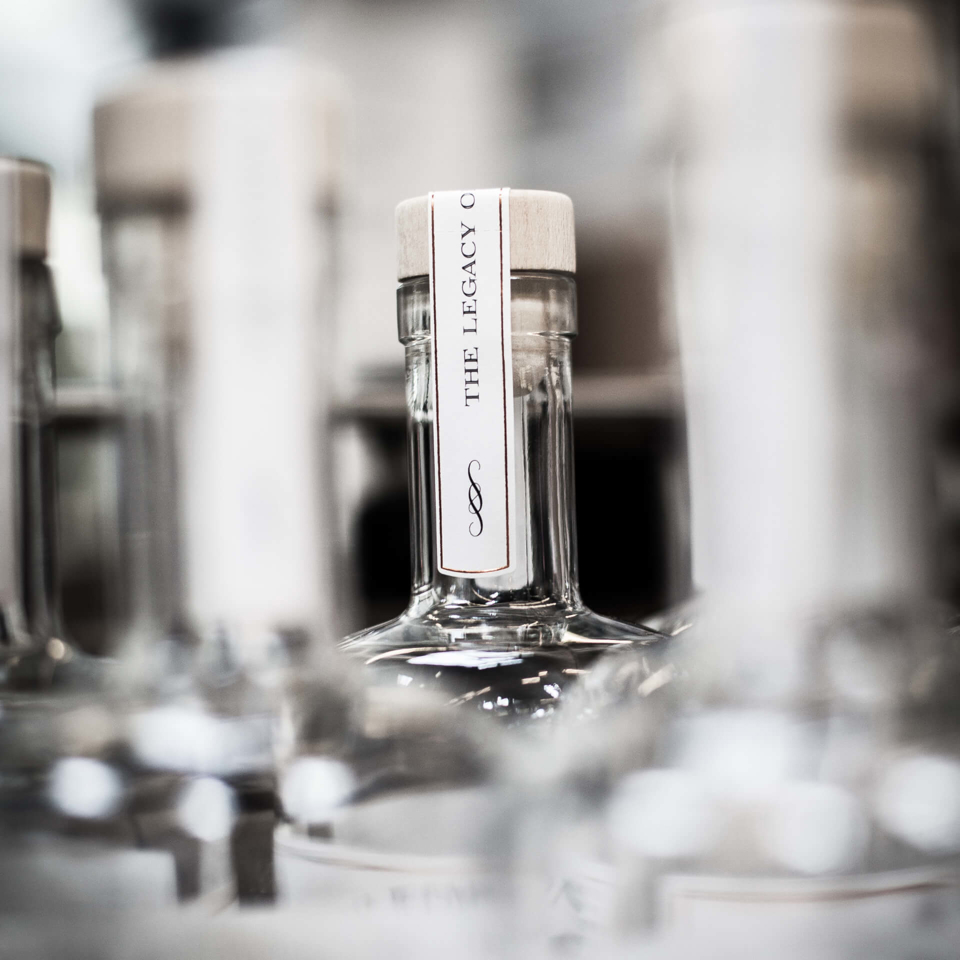 Production branding image showing a few Sir Edmond gin bottles.