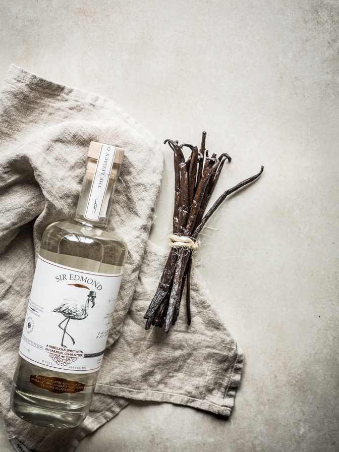 Branding image of Sir Edmond gin bottle and ingredients.